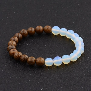 Detail of wooden beads and white translucent stones on a beaded bracelet for couples