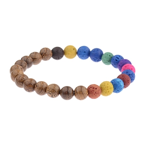 Detail of beaded bracelet with natural wood grains and colorful volcanic lava stones