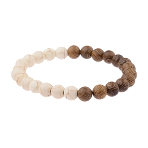 Close-up of white marble stones and dark wood beads on a stretch bracelet band