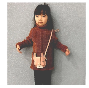 Pink cartoon rabbit crossbody bag for kids shown on a child model with a grey background