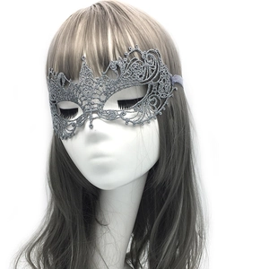 Silver lace phoenix mask with glitter detail shown on a mannequin head for Halloween party