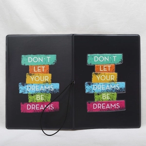 Black passport holder with motivational slogan and elastic closure for travel organizer