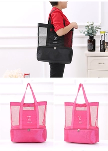 Detail view of double-layer mesh beach bag with zippered cooler base and shoulder strap
