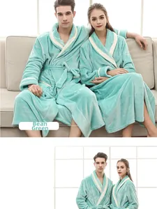 Detail view of the mint green plush flannel bathrobe with white contrast trim and waist tie