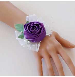 Elegant purple silk rose bridal wrist corsage with white ribbons and pearl accents