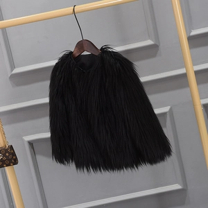 Close-up of thick black faux fur vest with soft plush texture for winter layering