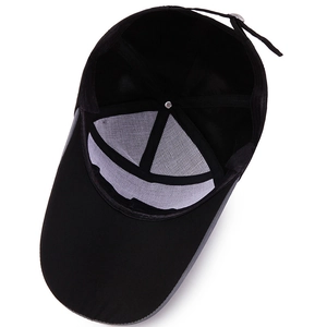 Internal view of black baseball cap showing breathable mesh lining and adjustable strap