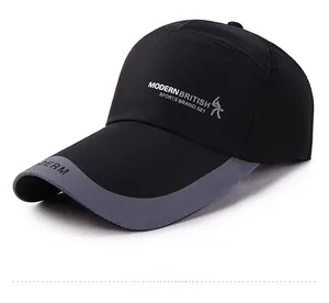 Detail of black baseball cap with grey brim edging and Modern British side embroidery