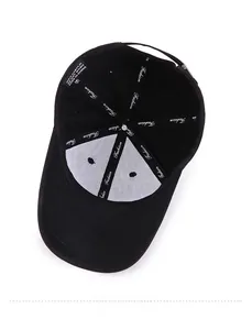 Interior detail of a black baseball cap showing the 100% acrylic material and quality stitching