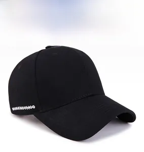 Detail of classic black cotton baseball cap showing white side letter embroidery