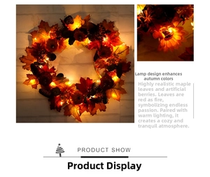 Detail of warm LED lights glowing on autumn maple leaf wreath with pumpkins and pinecones