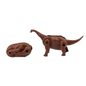 Macro detail of brown brachiosaurus toy showing dual transformation from egg to dinosaur