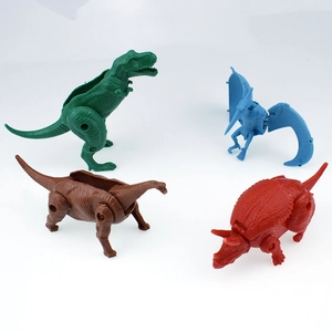 Set of four colorful transformable dinosaur eggs including T-Rex and Pterodactyl