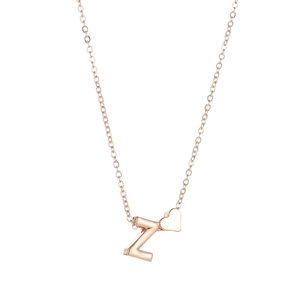 Detailed macro view of rose gold necklace featuring letter Z and heart pendant