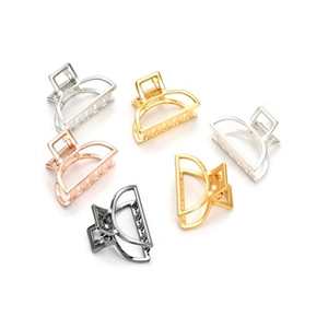 Close-up of six metal hair claws in gold, silver, rose gold and black colors