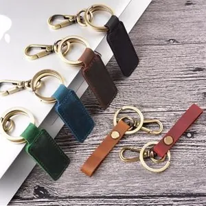 Detail of vintage leather keychains with brass metal rings in six assorted colors