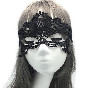 Elegant black lace masquerade mask with intricate cutouts on a mannequin head