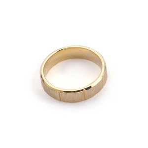 Minimalist gold plated stainless steel ring with brushed texture and polished grooves