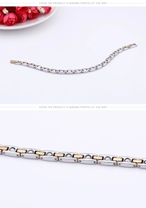 Macro view of two-tone gold and silver magnetic steel bracelet for couples