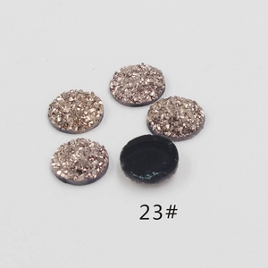Macro shot of 12mm round resin rhinestones with textured druzy finish in metallic copper