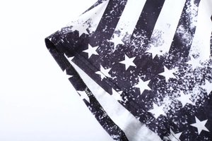 Close-up of tight stitching and vintage American flag print on knit fabric hem