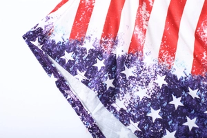 Close-up of American flag print on cotton T-shirt showing sewing and fabric texture
