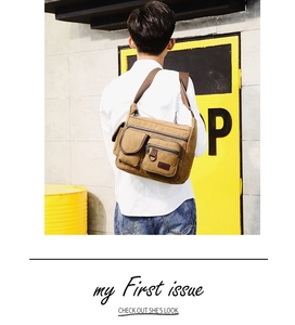 Rear view of man wearing a large brown canvas crossbody bag with multi-pocket design