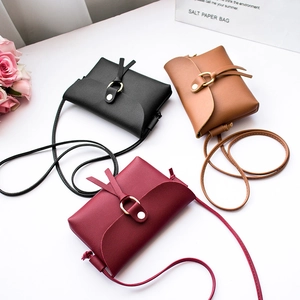 Mini crossbody bags in black, brown and burgundy with metal buckles and pearl details