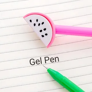 Creative dragon fruit gel pen with pink barrel and green tip on a lined notebook