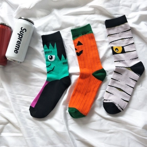 Detailed close-up of Frankenstein, Pumpkin and Mummy themed cotton crew socks set