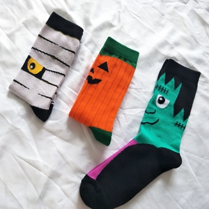Three-pack Halloween crew socks featuring mummy, pumpkin, and Frankenstein designs