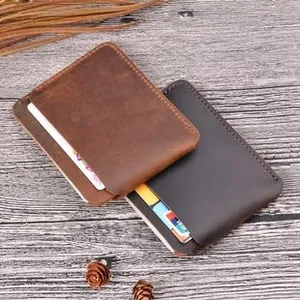 Macro shot of ultra-thin crazy horse leather card holder with handmade stitching details