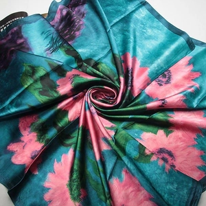 Elegant teal silk scarf featuring large pink floral oil painting print in a swirl fold