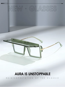 Detail of translucent green frame sunglasses with unique flip-top and gold metal temples