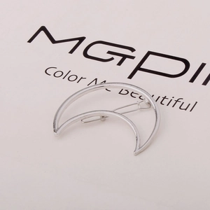 Minimalist silver crescent moon hair clip with a sleek metallic geometric triangle design