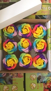 Detailed top view of rainbow soap rose flowers in a gift box for DIY wedding gifts