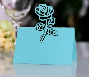 Detailed laser-cut blue rose place card for weddings with floral hollow design