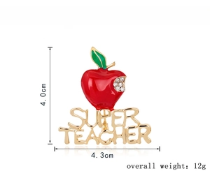 Detail of red apple brooch with gold Super Teacher lettering and crystal accents