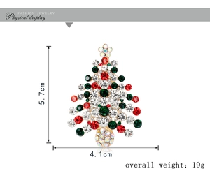 Detailed view of rhinestone Christmas tree brooch showing dimensions of 5.7cm by 4.1cm