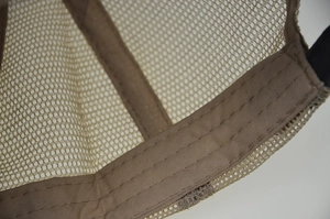 Close-up of the breathable nylon mesh and reinforced inner stitching of the khaki cap