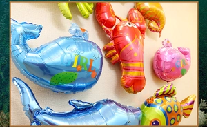 Detail of colorful marine animal balloons featuring whale and lobster shapes for parties