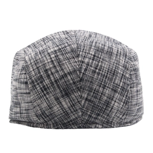 Classic black and white tweed flat cap featuring retro British herringbone stripe texture