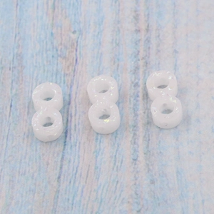 Three white synthetic opal infinite beads with iridescent glow for DIY jewelry making
