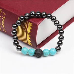 Detail of magnetic hematite elastic bracelet with blue turquoise and lava stone beads