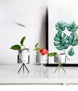 Modern white marble ceramic plant pots with minimalist gold black and white metal tripod stands