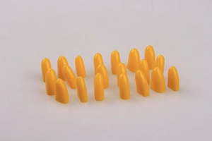 Detailed view of twenty bright yellow protective plastic pet nail caps for cats and dogs