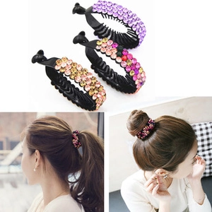 Detailed view of bird nest hair clips with colorful rhinestones for high ponytails
