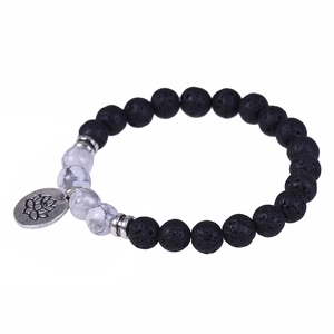Lava stone and white turquoise beaded bracelet with silver lotus flower pendant charm