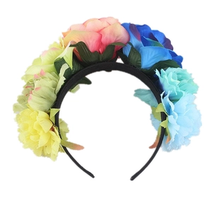 Close-up of colorful artificial silk roses on a floral headband for festivals