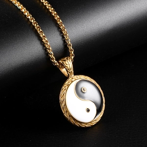 Gold stainless steel necklace featuring a circular black and white Yin Yang pendant charm